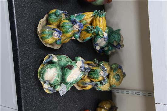 Six Chinese Canton pottery models of stacking fruit in dishes, late 19th century, height 16cm - 18.5cm